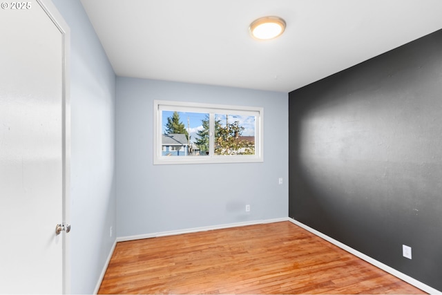 spare room featuring light wood-type flooring