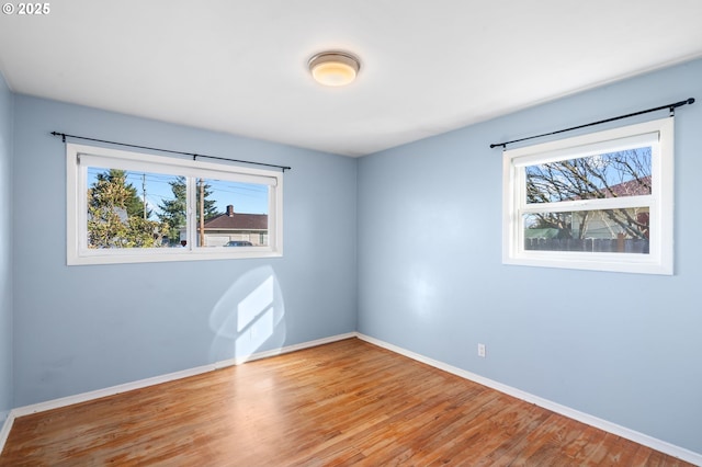 spare room featuring light hardwood / wood-style flooring