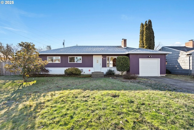 single story home with a garage and a front lawn