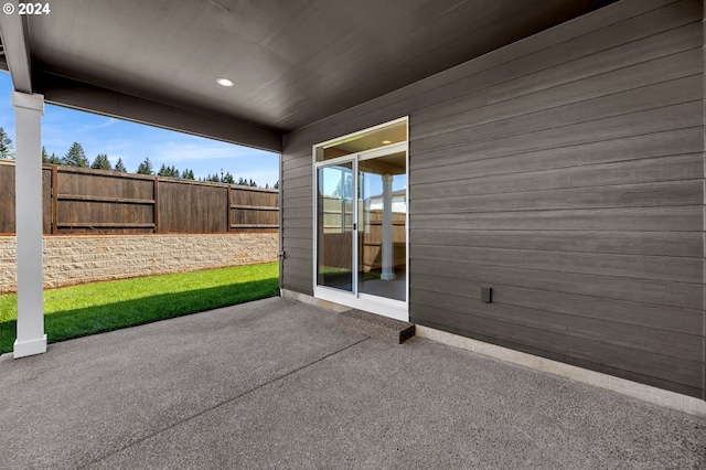 view of patio / terrace featuring fence