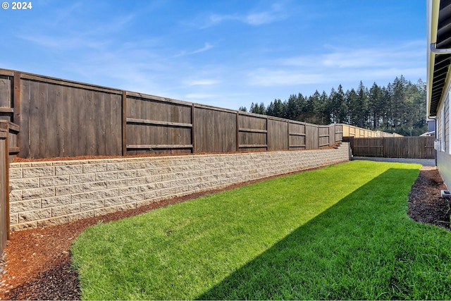 view of yard with a fenced backyard