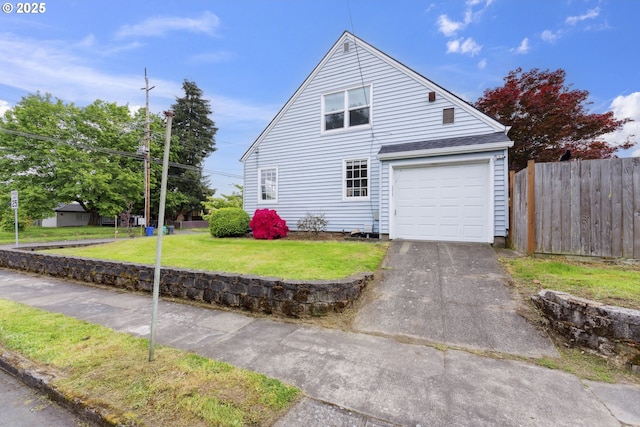 view of property exterior with a garage and driveway