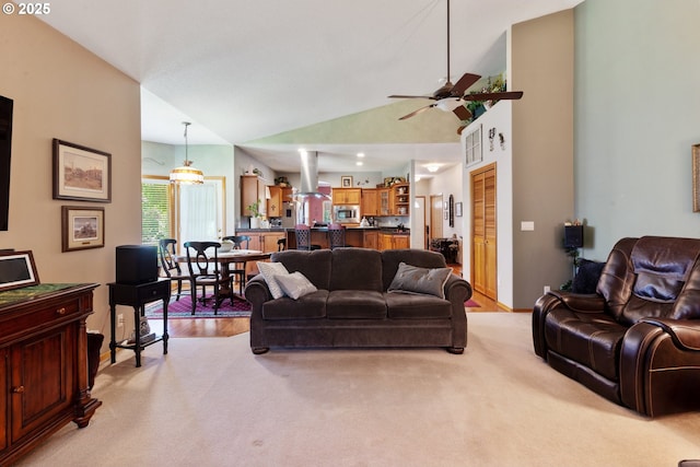 1506 E Heritage Loop, La Center, WA 98629 - living area with vaulted ceiling, a ceiling fan, and light wood-type flooring