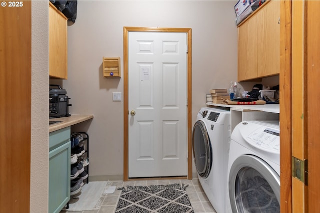 1506 E Heritage Loop, La Center, WA 98629 - washroom with independent washer and dryer, cabinet space, and light tile patterned floors
