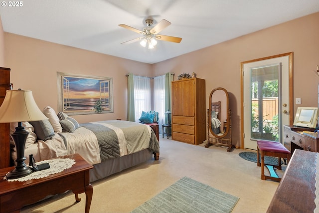 1506 E Heritage Loop, La Center, WA 98629 - bedroom with multiple windows, light carpet, a ceiling fan, and access to outside