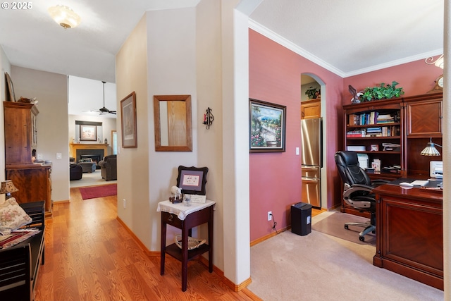 1506 E Heritage Loop, La Center, WA 98629 - office space featuring a ceiling fan, arched walkways, a fireplace, light wood-type flooring, and ornamental molding