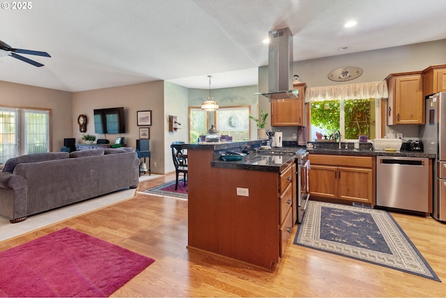 1506 E Heritage Loop, La Center, WA 98629 - kitchen with stainless steel appliances, open floor plan, island exhaust hood, healthy amount of natural light, and recessed lighting