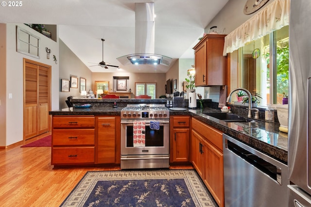 1506 E Heritage Loop, La Center, WA 98629 - kitchen featuring stainless steel appliances, island exhaust hood, a peninsula, open floor plan, and ceiling fan