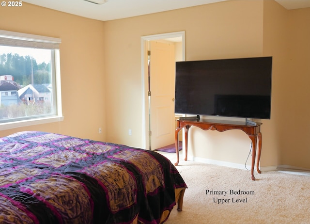 carpeted bedroom with baseboards