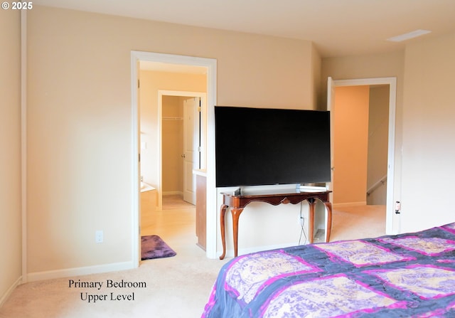 carpeted bedroom featuring baseboards