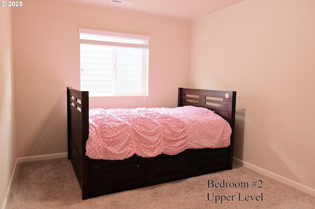 bedroom featuring baseboards, carpet floors, and visible vents