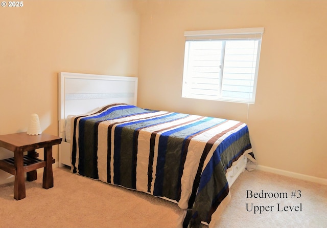 bedroom featuring baseboards and carpet flooring