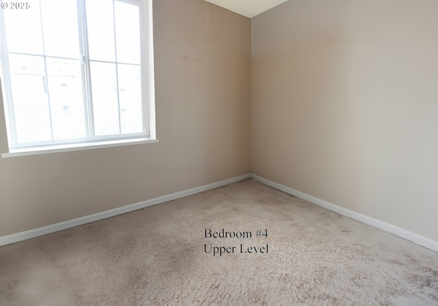 empty room with baseboards