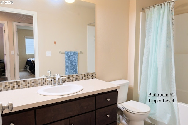 bathroom featuring connected bathroom, tasteful backsplash, toilet, and vanity