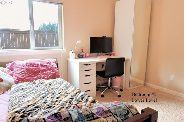 carpeted bedroom with baseboards