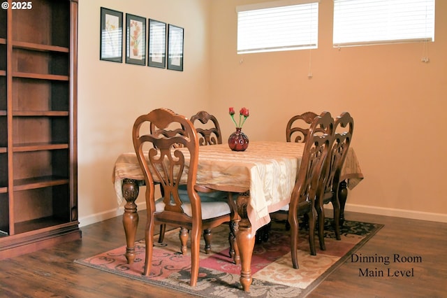 dining area featuring baseboards and wood finished floors