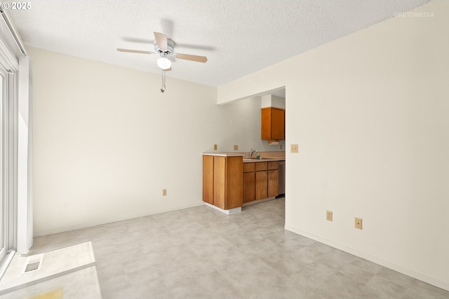 5312 SW Erickson Ave, Beaverton, OR 97005 - unfurnished living room with a ceiling fan, a textured ceiling, and light floors