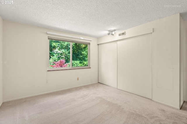 5312 SW Erickson Ave, Beaverton, OR 97005 - unfurnished bedroom featuring a closet, a textured ceiling, and carpet floors