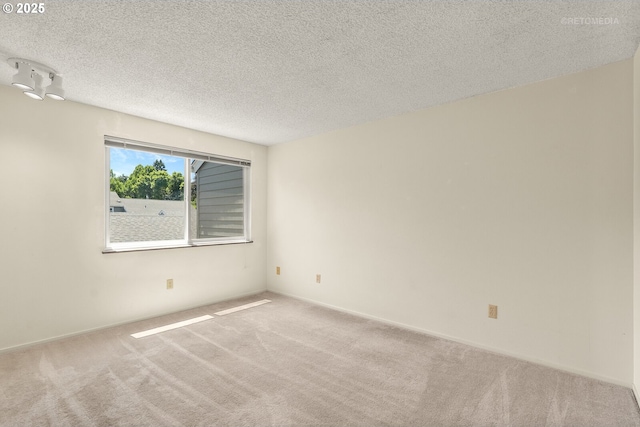 5312 SW Erickson Ave, Beaverton, OR 97005 - empty room with carpet floors and a textured ceiling