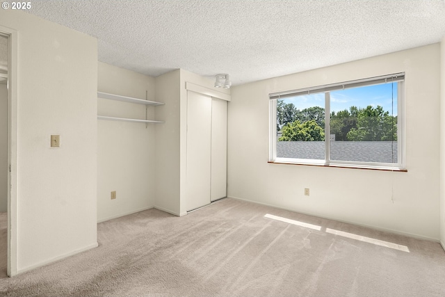 5312 SW Erickson Ave, Beaverton, OR 97005 - unfurnished bedroom with carpet, a closet, and a textured ceiling