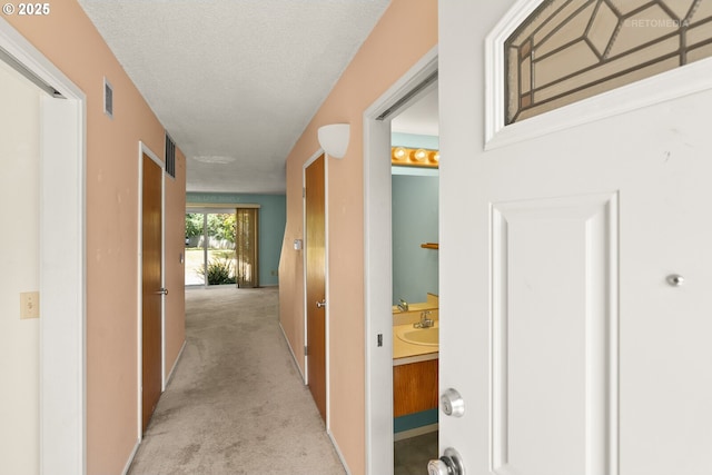 5312 SW Erickson Ave, Beaverton, OR 97005 - hallway with carpet floors and a textured ceiling