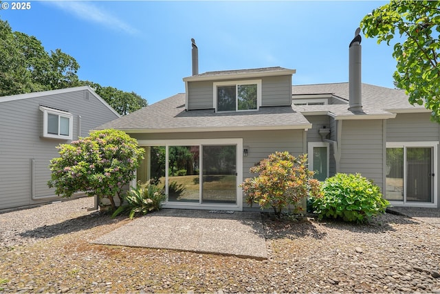 5312 SW Erickson Ave, Beaverton, OR 97005 - rear view of property featuring a shingled roof and a patio area