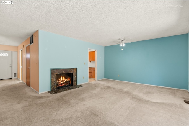 5312 SW Erickson Ave, Beaverton, OR 97005 - unfurnished living room with carpet, a ceiling fan, a fireplace, and a textured ceiling