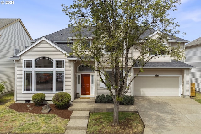 traditional-style home with a shingled roof and driveway