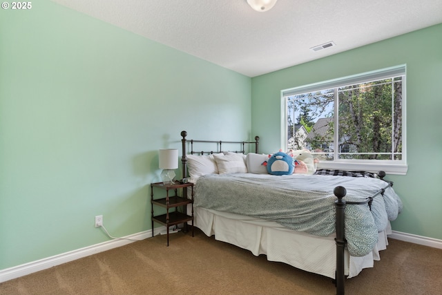 bedroom with carpet flooring and baseboards
