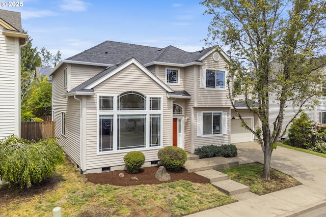traditional-style home featuring driveway, fence, a garage, crawl space, and a shingled roof
