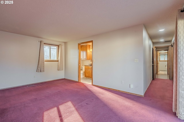 unfurnished room with light carpet