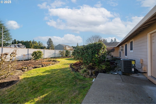 view of yard with a patio and central air condition unit