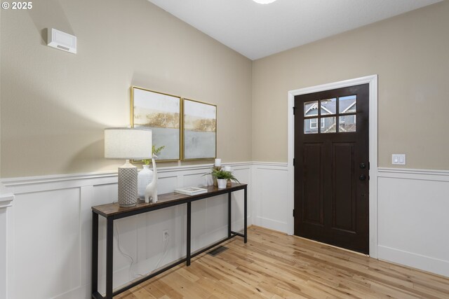 foyer entrance with light hardwood / wood-style floors