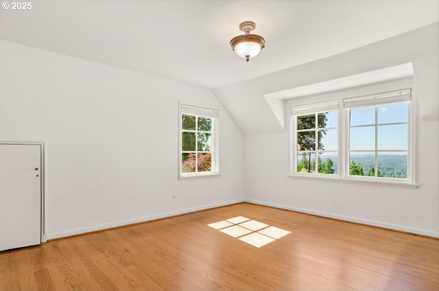 4326 SW Arthur Way, Portland, OR 97221 - bonus room featuring wood finished floors, vaulted ceiling, and baseboards