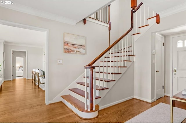 4326 SW Arthur Way, Portland, OR 97221 - staircase with ornamental molding, wood finished floors, and baseboards