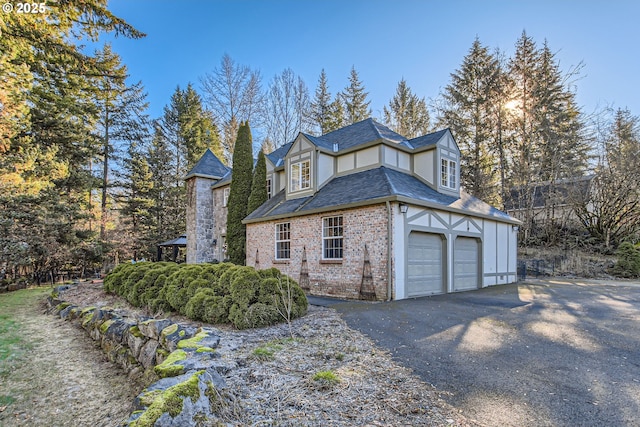 view of side of home with a garage