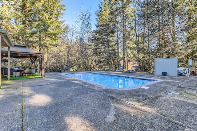 view of pool featuring a gazebo and a patio area