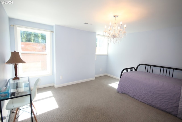 carpeted bedroom with multiple windows and an inviting chandelier