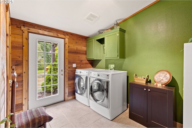 156 Peppermill Rd, Kelso, WA 98626 - laundry room featuring cabinet space, washer and dryer, wood walls, light tile patterned flooring, and a textured wall