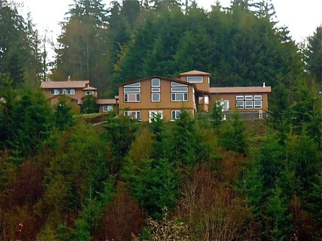 156 Peppermill Rd, Kelso, WA 98626 - view of front of property with a view of trees and stucco siding
