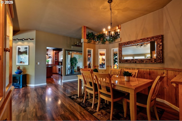 156 Peppermill Rd, Kelso, WA 98626 - dining space featuring dark wood-style floors, a chandelier, wood walls, and wainscoting