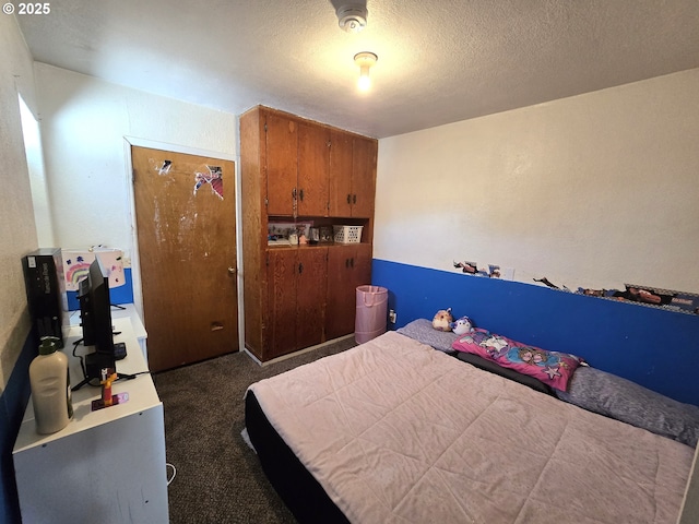 1055 W Madrona Ave, Hermiston, OR 97838 - bedroom with dark carpet and a textured ceiling