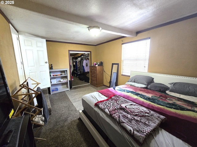 1055 W Madrona Ave, Hermiston, OR 97838 - carpeted bedroom with a textured ceiling, beam ceiling, and a closet