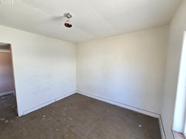 1055 W Madrona Ave, Hermiston, OR 97838 - spare room with hardwood / wood-style floors and a textured ceiling