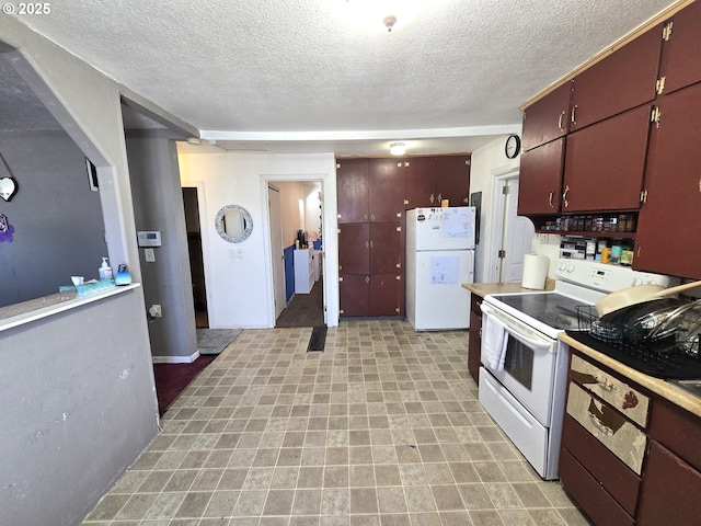 1055 W Madrona Ave, Hermiston, OR 97838 - kitchen featuring white appliances, a textured ceiling, and light countertops