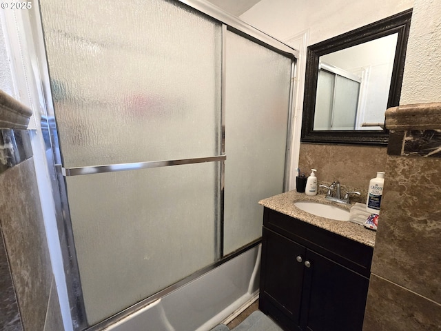 1055 W Madrona Ave, Hermiston, OR 97838 - bathroom featuring vanity and bath / shower combo with glass door
