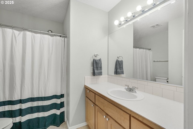 17364 SW Novato Ln, Beaverton, OR 97078 - full bath with toilet, vanity, a textured ceiling, and a shower with shower curtain