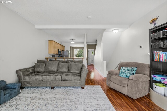 17364 SW Novato Ln, Beaverton, OR 97078 - living room with dark wood finished floors, beam ceiling, and ceiling fan
