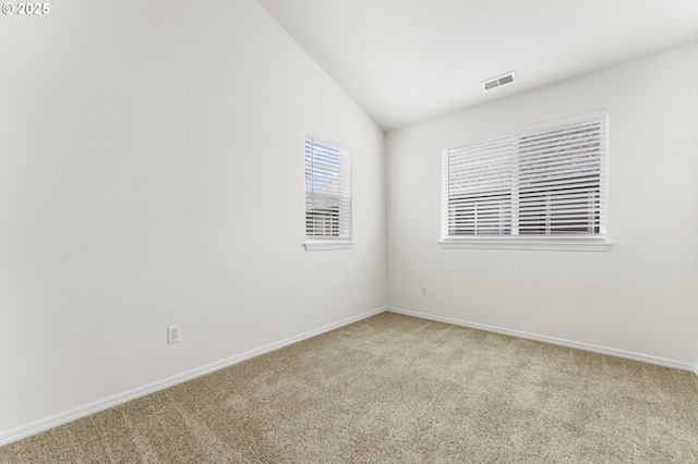 9234 SW Cascara Ln, Tualatin, OR 97062 - spare room with carpet floors, lofted ceiling, and baseboards
