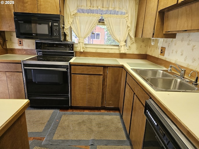 kitchen featuring black appliances and sink